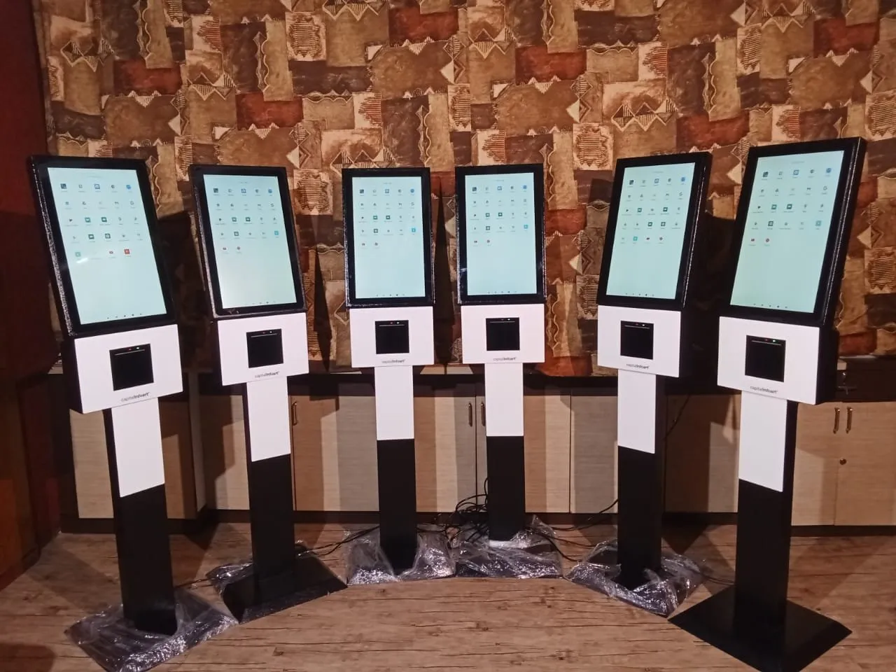 Six Interactive Service Kiosks with printer slots ready for dispatch